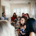 Women sitting around a meeting table (photo credit Junior League of San Diego)